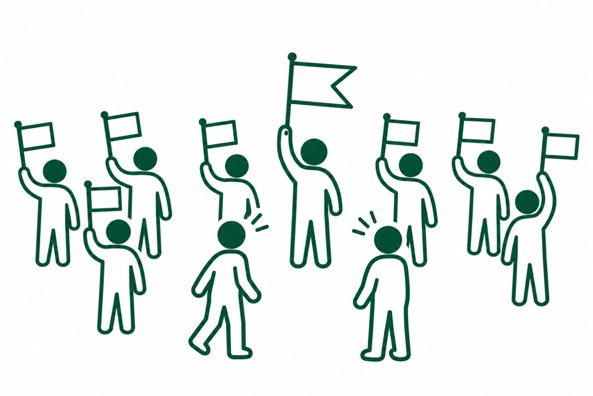 違う旗の前で通る人が足を止める図